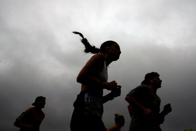 Runners are used to toughing it out. A warming climate can make that deadly