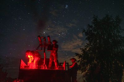 With men at the front lines, women watch over Ukraine's night sky for Russian drones