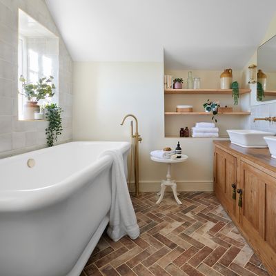 This elegant farmhouse style bathroom is a masterclass in making this trend look luxurious