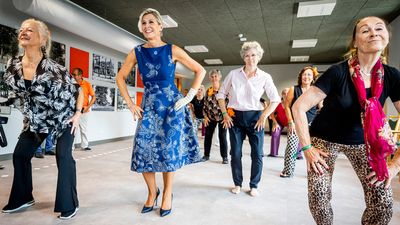 Queen Maxima just re-wore the most stunning royal blue dress with whimsical print – it's the best wedding guest dress for late summer nuptials