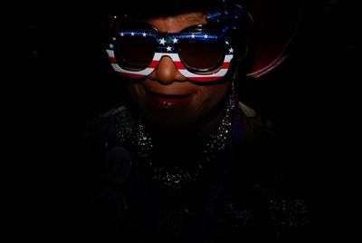 Using some ingenuity with a flash, an AP photographer gets to the red, white and blue of a portrait