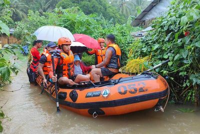 Storm floods northern Philippine regions, including capital, disrupting schools, work and travel