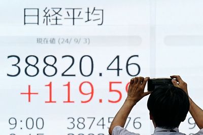 Global shares trade mostly lower as investors wait for key US jobs report