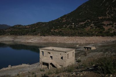 Village that disappeared underwater emerges in Greece as another lake dries up