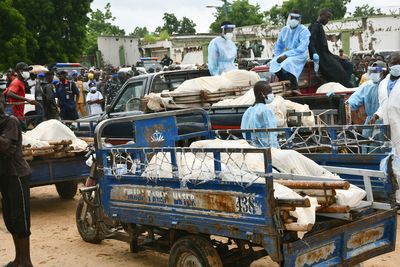 Boko Haram militants on motorcycles attacked a Nigerian village, killing over 100, residents say