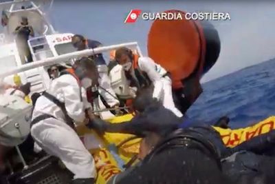 About 20 migrants are reported missing after their boat capsized off Italy