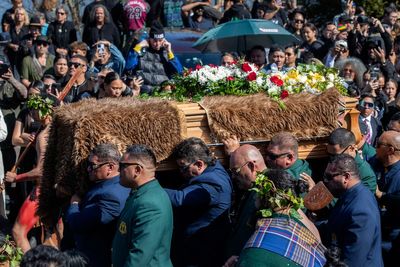 A Māori king who urged racial unity in New Zealand is laid to rest and a new queen rises