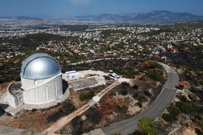 AP PHOTOS: A ferocious blaze scars the land outside Greece’s capital