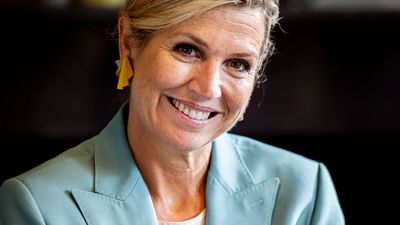 Queen Maxima goes bold in head-to-toe turquoise power suit that's the perfect alternative to muted autumn shades