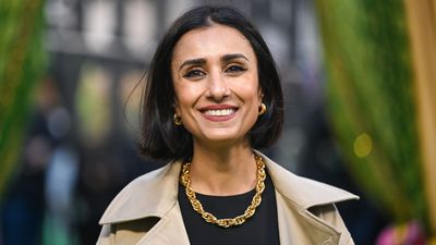 Anita Rani battles the autumn wind in style with a tie dye jumper and chunky black boots