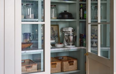 6 Stylish Small Pantry Ideas — Including a Genius One Hidden Behind the Kitchen Backsplash