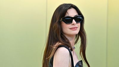 Anne Hathaway combines rich browns and earthy greens to bring sophistication to her living room corner – designers say it has 'transportive' qualities