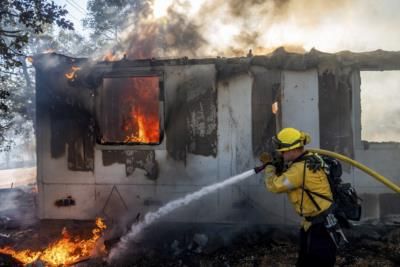 Southern California Wildfires Threaten Thousands, Cooler Weather Expected