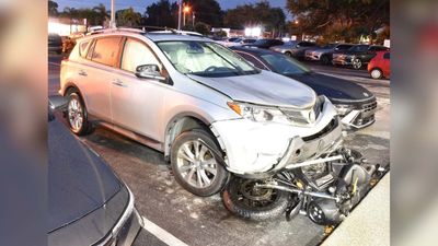 Driver Plows Into Motorcyclist, Tries To Flee With Bike Wedged Under Car