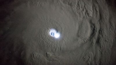 Earth from space: Successive lightning strikes illuminate eye of tropical cyclone in rare photos