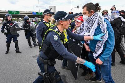 Anti-war protesters clash with police outside Australian arms convention