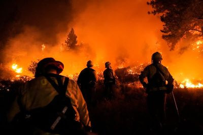 AP PHOTOS: As wildfires burn in California, firefighters work to squelch the flames