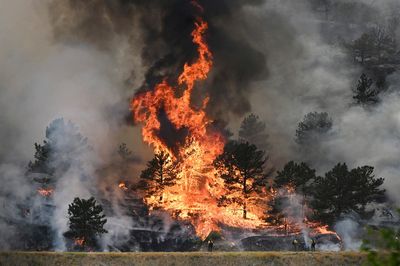 A Colorado man is charged with arson in a wildfire that destroyed 26 homes