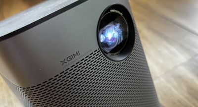 I added this mini projector to my home gaming setup, and it's a game-changer