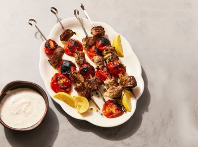 A garlicky yogurt marinade pulls double duty in souvlaki-inspired pork skewers