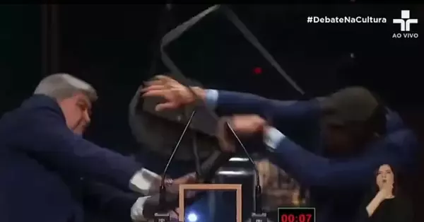 WATCH: Popular journalist beats up right-wing San Paulo politician with metal chair during live TV debate