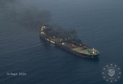 Burning oil tanker safely towed away from Yemen after rebel attacks, EU says