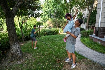 China's 'Full-time Dads' Challenge Patriarchal Norms