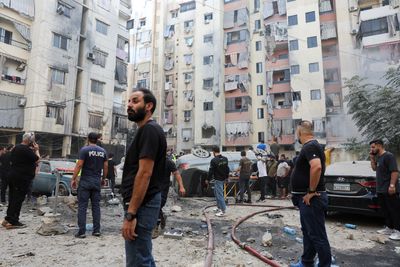 Israeli air attack on Beirut kills 14 as cross-border fire intensifies