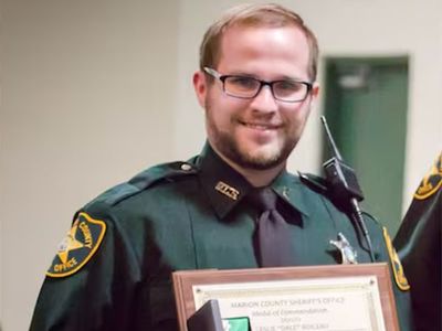 Florida deputy arrested after fatally shooting girlfriend while cleaning guns, police say