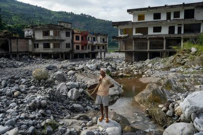 AP PHOTOS: Cascading disasters push residents of a Nepalese valley to the brink