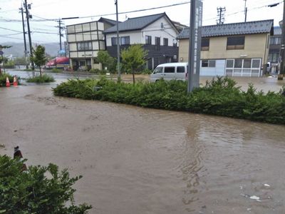 Japan orders thousands to evacuate quake-hit region as rains trigger floods