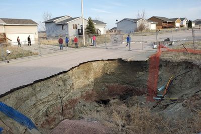 Giant sinkholes in a South Dakota neighborhood make families fear for their safety