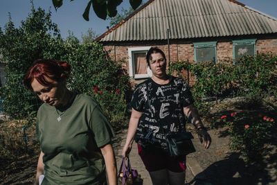 ‘Everything is left behind’: as Russians close in on Ukrainian city, families agonise whether to flee