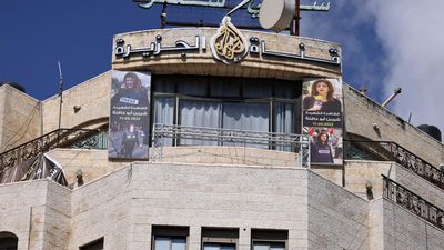 Israeli forces raid and shut down Al Jazeera's bureau in West Bank