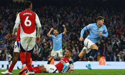 Stones rescues Manchester City with late equaliser against 10-man Arsenal