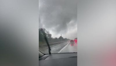 Tornado hits Luton as streets flooded and cars submerged outside London