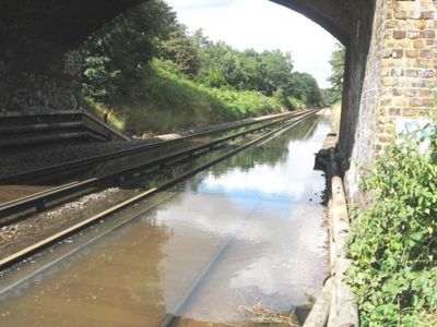 Travel chaos on tubes and trains after overnight flooding in London and southeast England