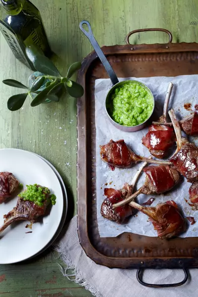 Prosciutto-wrapped lamb cutlets with pea puree