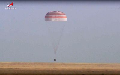 A Soyuz capsule with 2 Russians and 1 American from the International Space Station returns to Earth