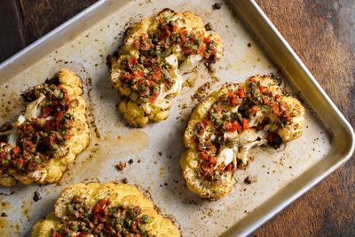 Nutty Parmesan, briny capers and pickled peppers turn cauliflower steaks into a satisfying main