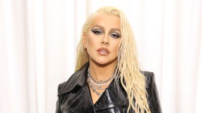 Christina Aguilera uses vibrant hibiscus, Zellige tiles, and soft neutrals to create the perfect Tuscan-style yard – garden experts love her on-trend look