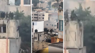 Israeli soldiers filmed throwing bodies from a West Bank roof