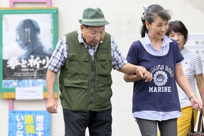 Japanese court acquits a former boxer in a 1966 murder retrial after decades on death row