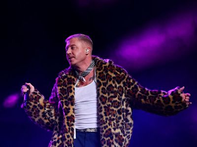 Macklemore explains outburst after being dropped from festival