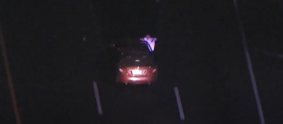 WATCH: Los Angeles Carjacker in High-Speed Chase Appears to Mock Cops, Take Selfies While Sticking Head Out Window