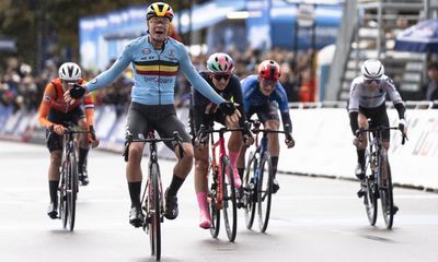 Lotte Kopecky battles through rain to retain world road race title in Zurich