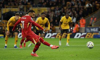 Mohamed Salah’s penalty sees off battling Wolves to send Liverpool top