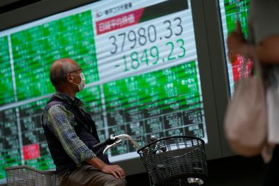 Japan's stocks slump after prime minister election; Shanghai benchmark soars more than 5%