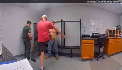 A sheriff is being retried on an assault charge for kicking a shackled detainee twice in the groin