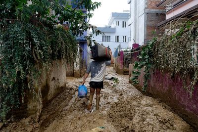 Rescuers search for people still missing in Nepal after flooding and landslides that killed 217